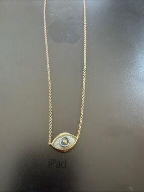 Gold toned evil eye sand filled
 necklace